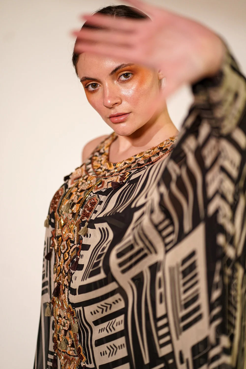 White Base Abstract Print Kaftan With Hand Thread And Wooden Embellishment