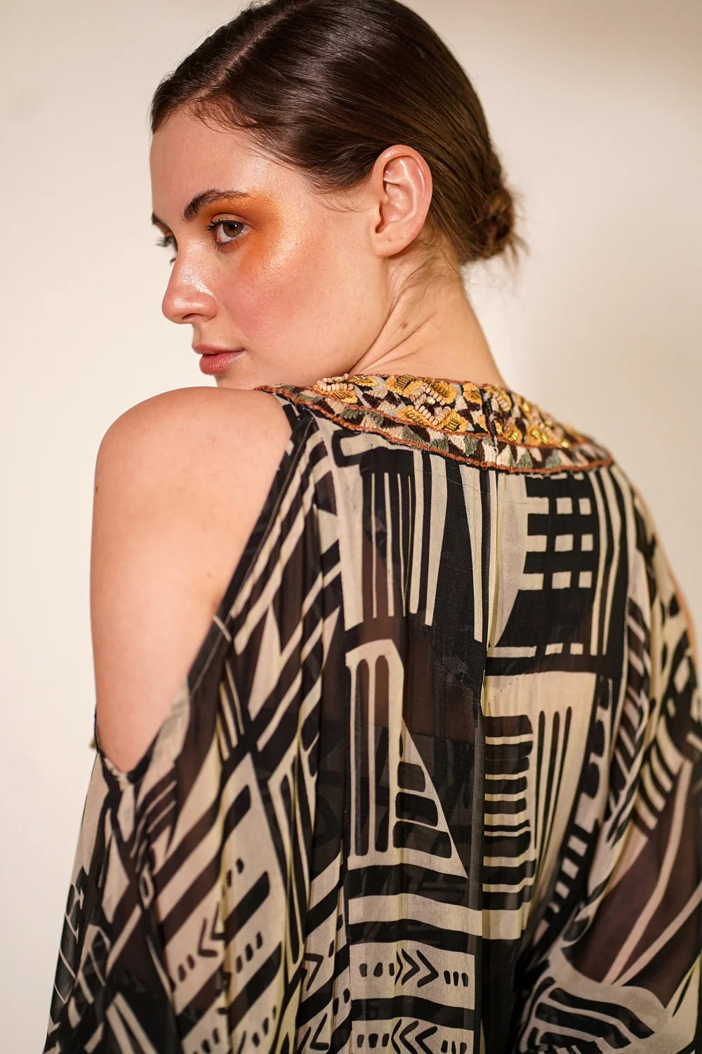 White Base Abstract Print Kaftan With Hand Thread And Wooden Embellishment