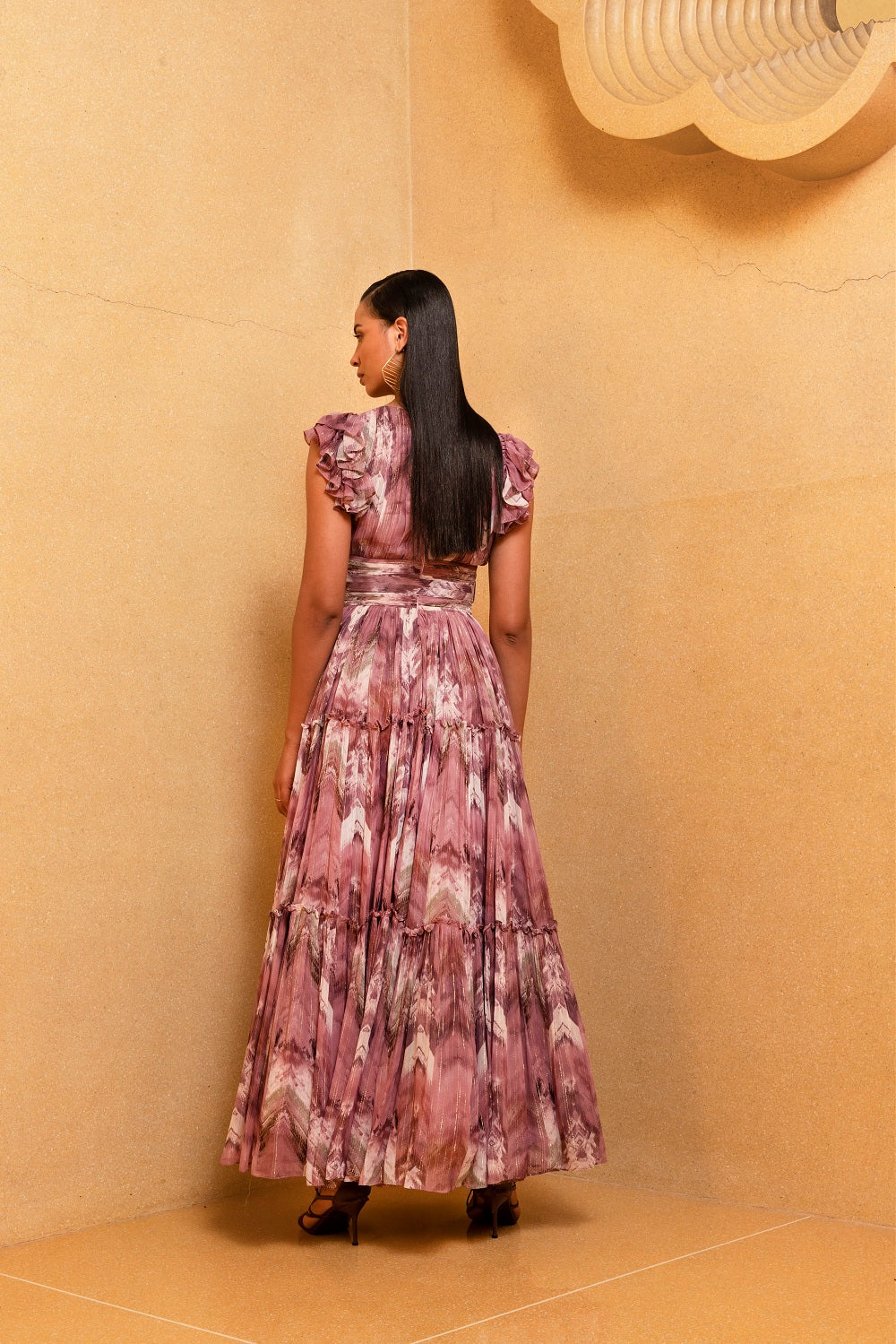 Back view of lilac floss print ruffle maxi dress with tiered skirt and belt