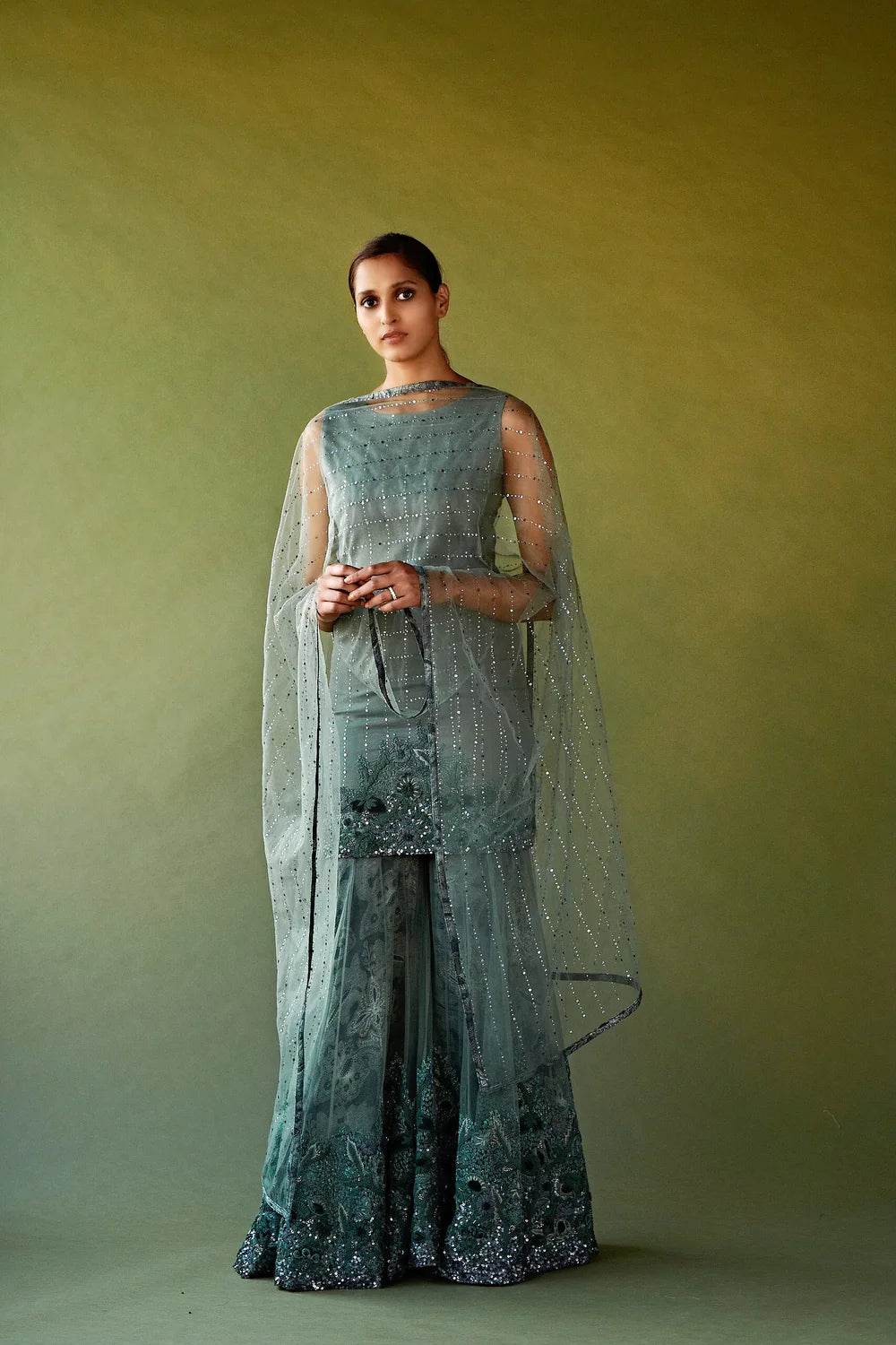 Jade green hand-embellished kurta paired with sharara pants and sheer dupatta